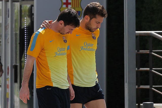 Barcelona forward Lionel Messi (L) and defender Jordi Alba at Barca's training camp