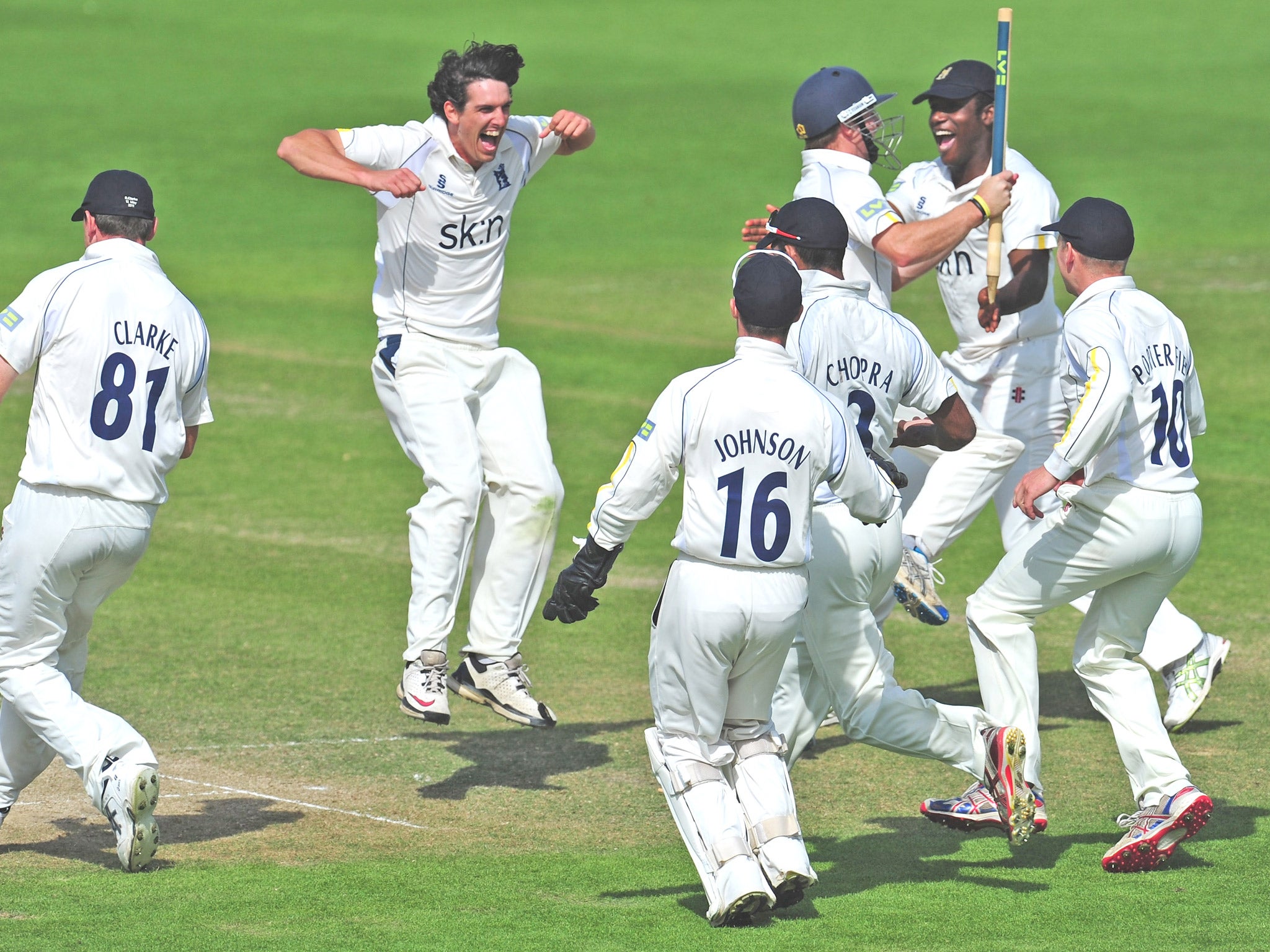 Chris Wright (second from left) and his Warwickshire teammates celebrate becoming County Champions last year