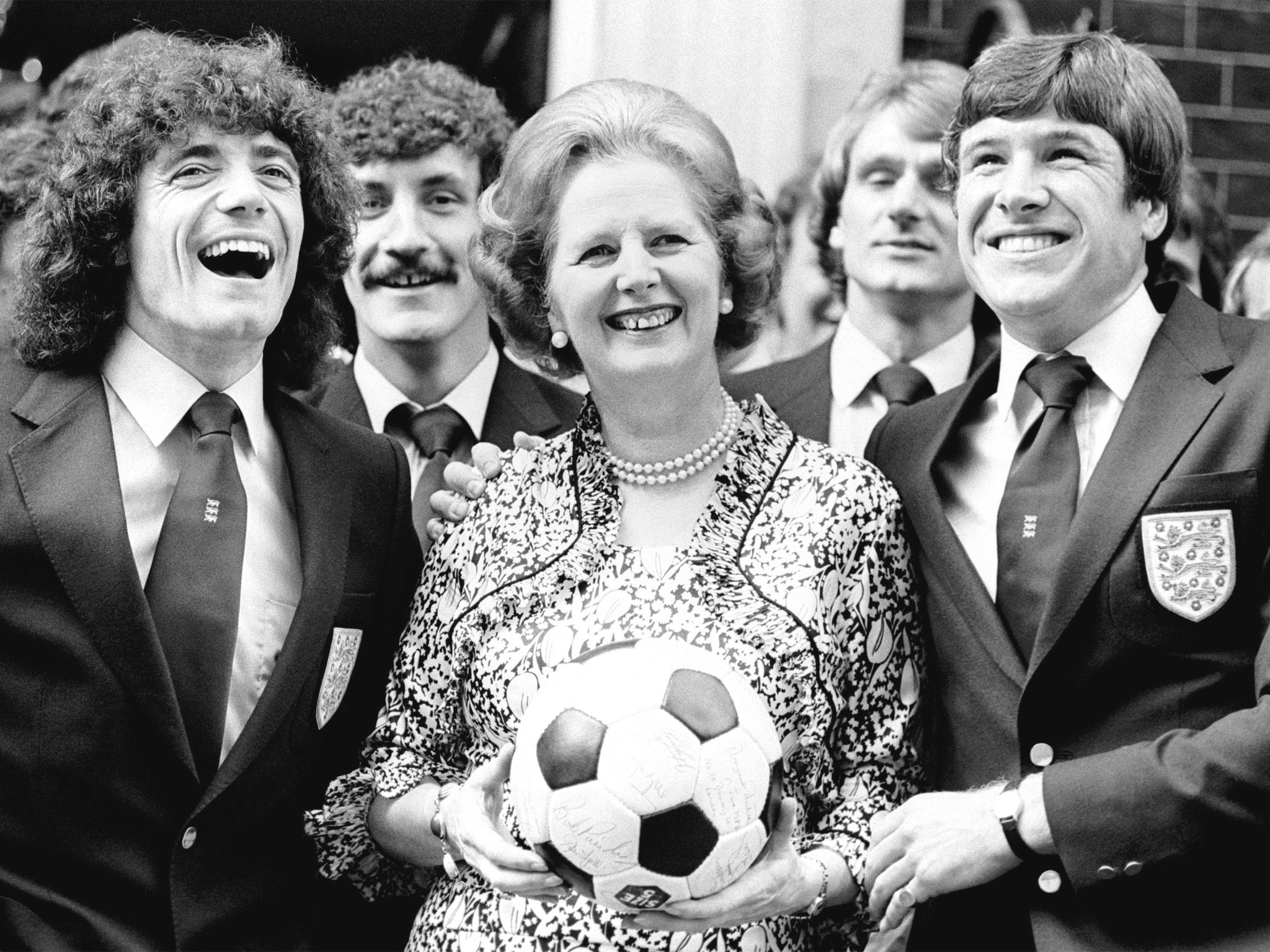 Margaret Thatcher takes advantage of a photo opportunity with Kevin Keegan (left), Emlyn Hughes and the rest of the England team of 1980