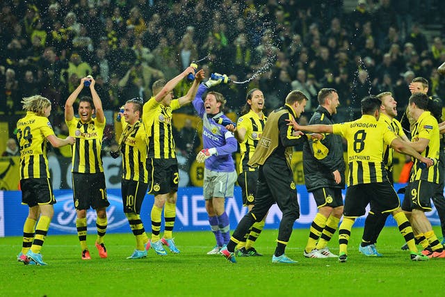 Borussia Dortmund players celebrate their last-gasp victory