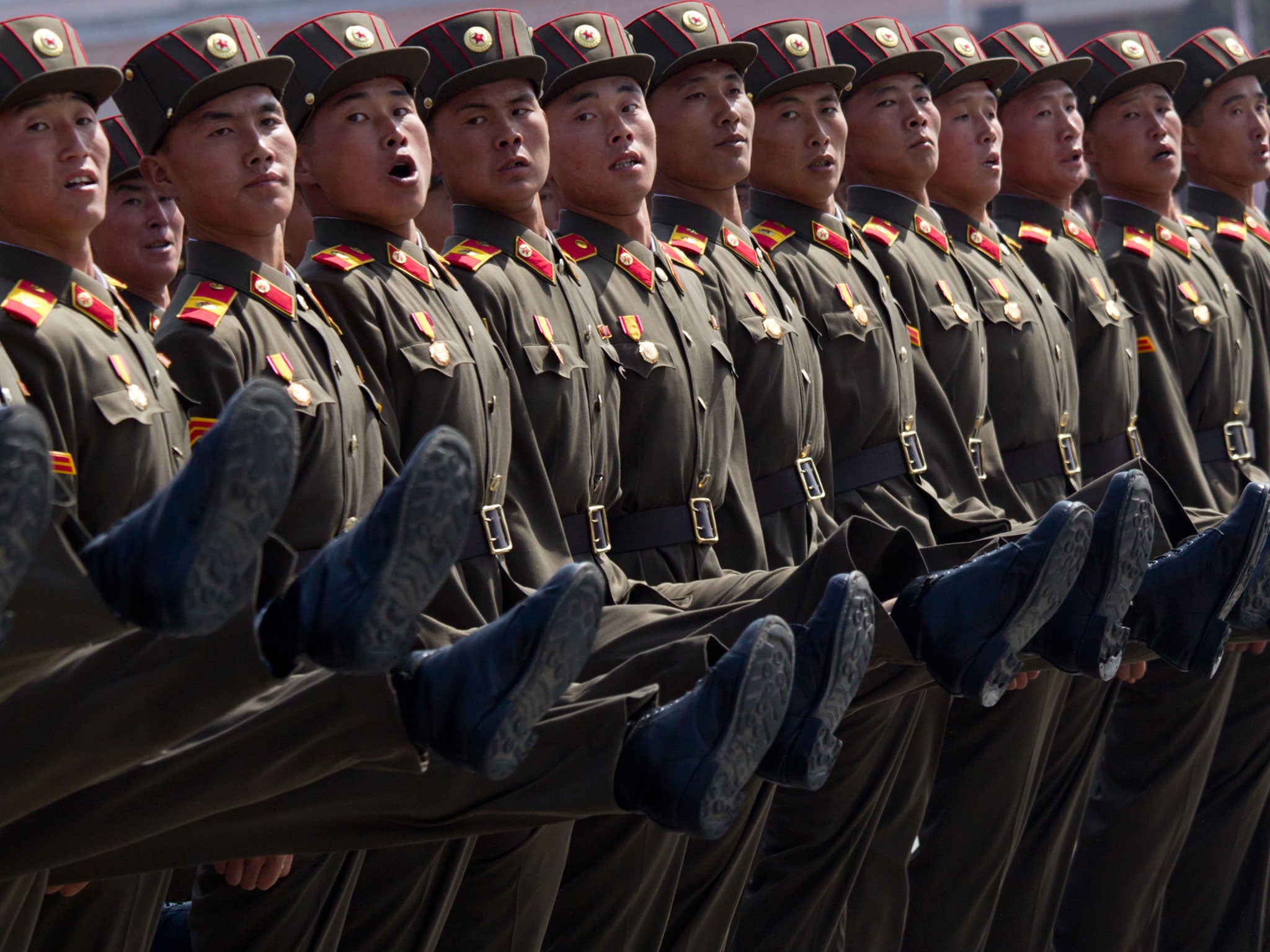 North Korean soldiers march during a military parade to mark 100 years since the birth of the country's founder Kim Il-Sung in Pyongyang on April 15, 2012.