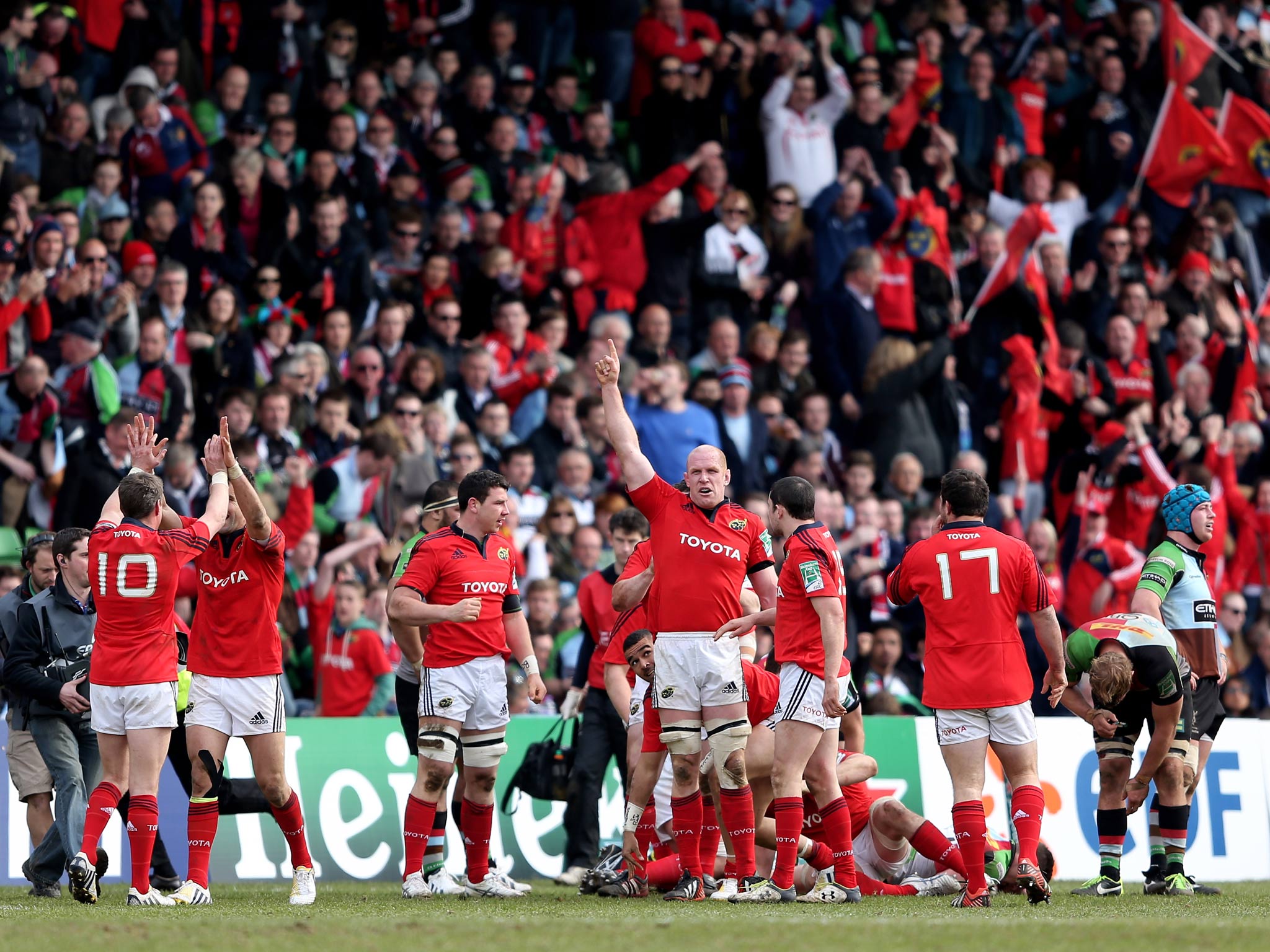 Munster celebrate during their victory over Quins