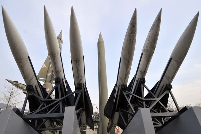 North Korean missile launcher has been moved into a firing position with its rockets facing skyward, according to Japanese media