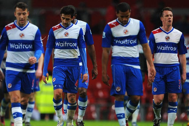 Reading players look dejected after their recent defeat against Manchester United at Old Trafford in the Premier League 