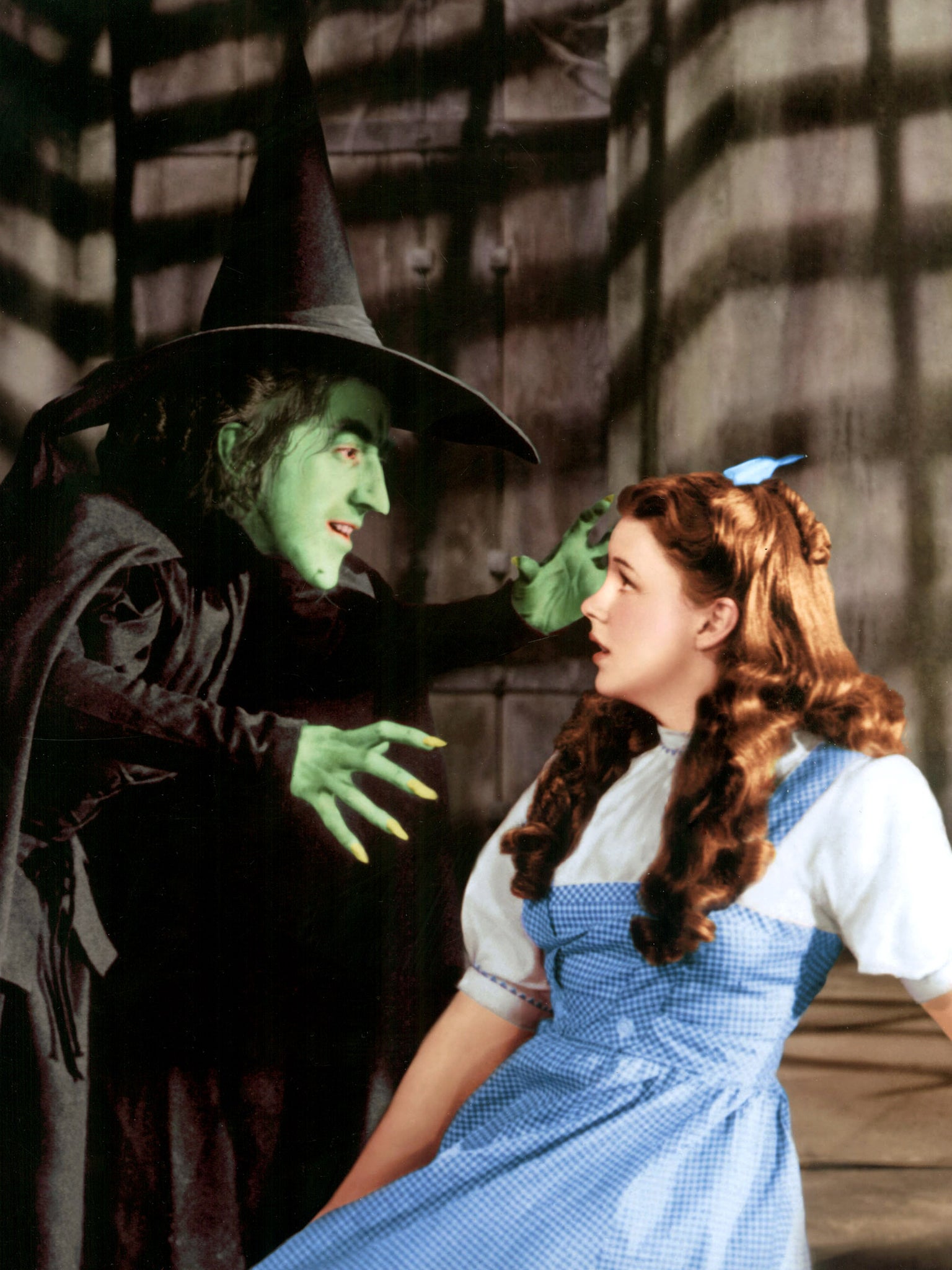 Judy Garland and the Wicked Witch in The Wizard Of Oz.