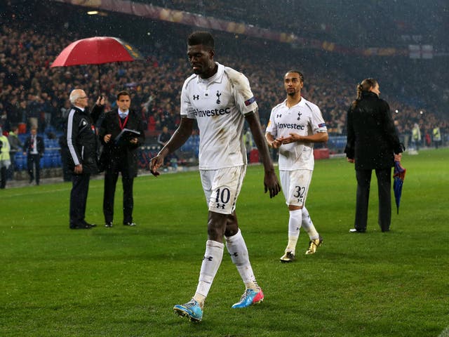 Emmanuel Adebayor leaves the pitch in Basel after defeat on penalties