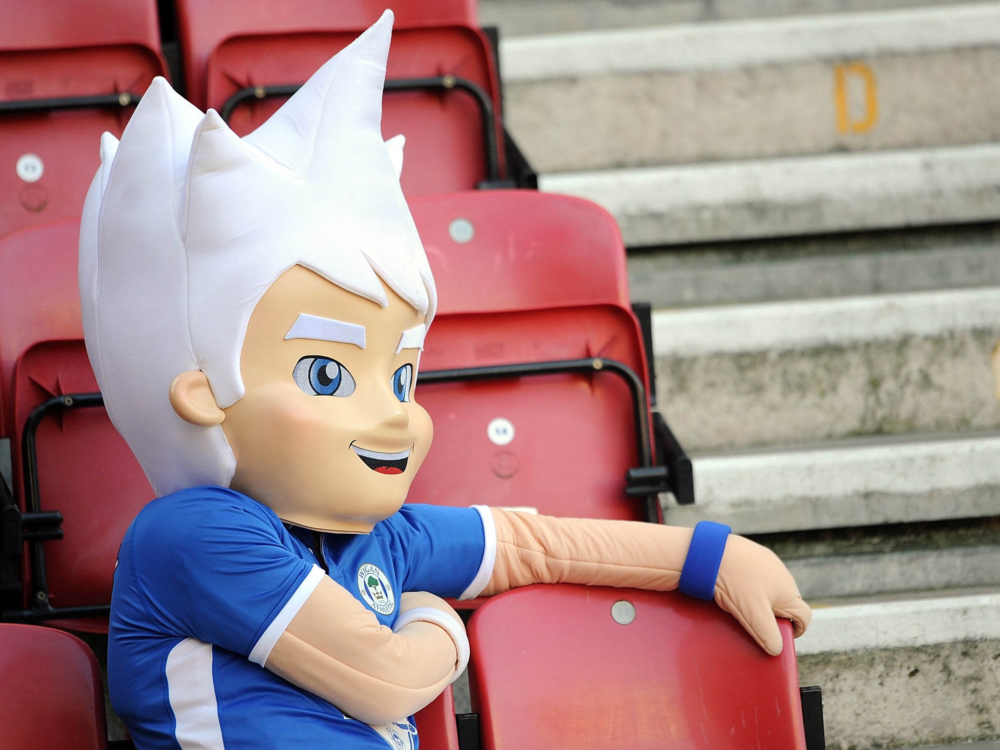 The Wigan Athletic mascot looks on as the Premier League team play