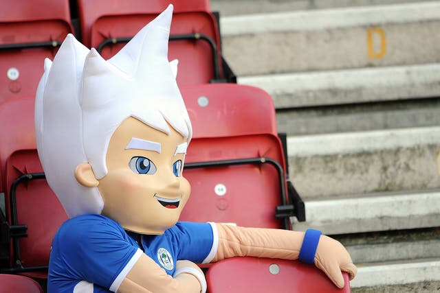 The Wigan Athletic mascot looks on as the Premier League team play