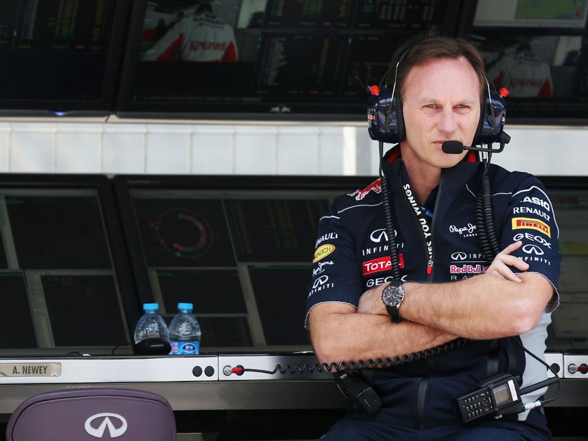 Christian Horner, the Red Bull team principal, watches his German driver Sebastian Vettel on track in practice yesterday