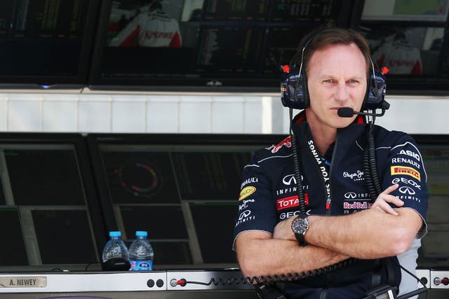 Christian Horner, the Red Bull team principal, watches his German driver Sebastian Vettel on track in practice yesterday 