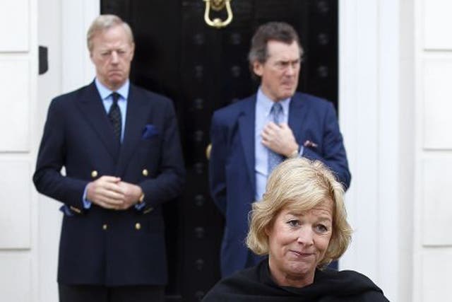 Carol Thatcher outside the family's Belgravia residence, suported by brother Mark, back left
