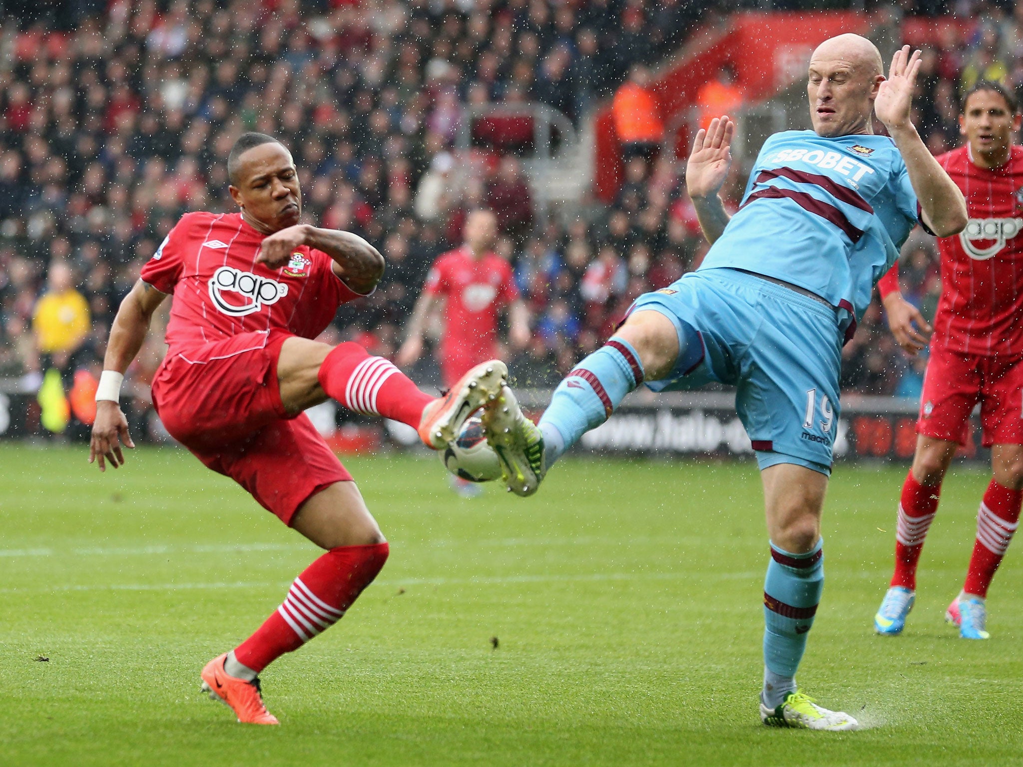 James Collins of West Ham tries to tackle Nathamiel Clyne of Southampton