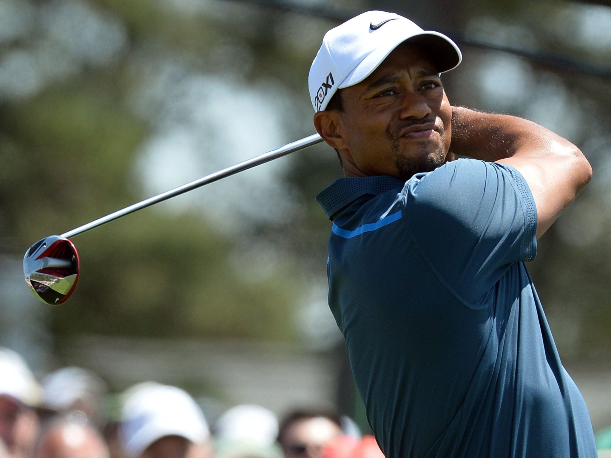 Tiger Woods teed off mired in a rules controversy after taking an incorrect drop on Friday