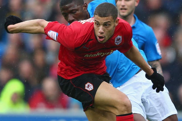 Rudy Gestede’s two goals took Championship leaders, Cardiff City, to the very brink of promotion 