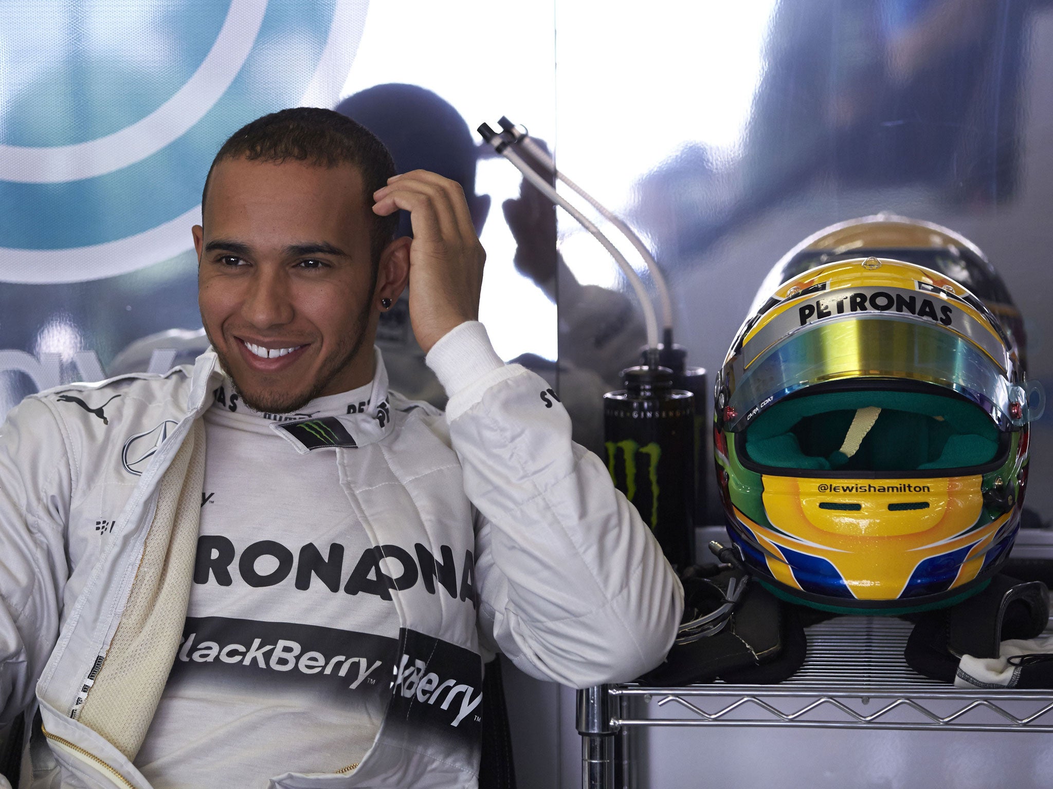 Smiles ahead: Lewis Hamilton is delighted after taking pole for Mercedes