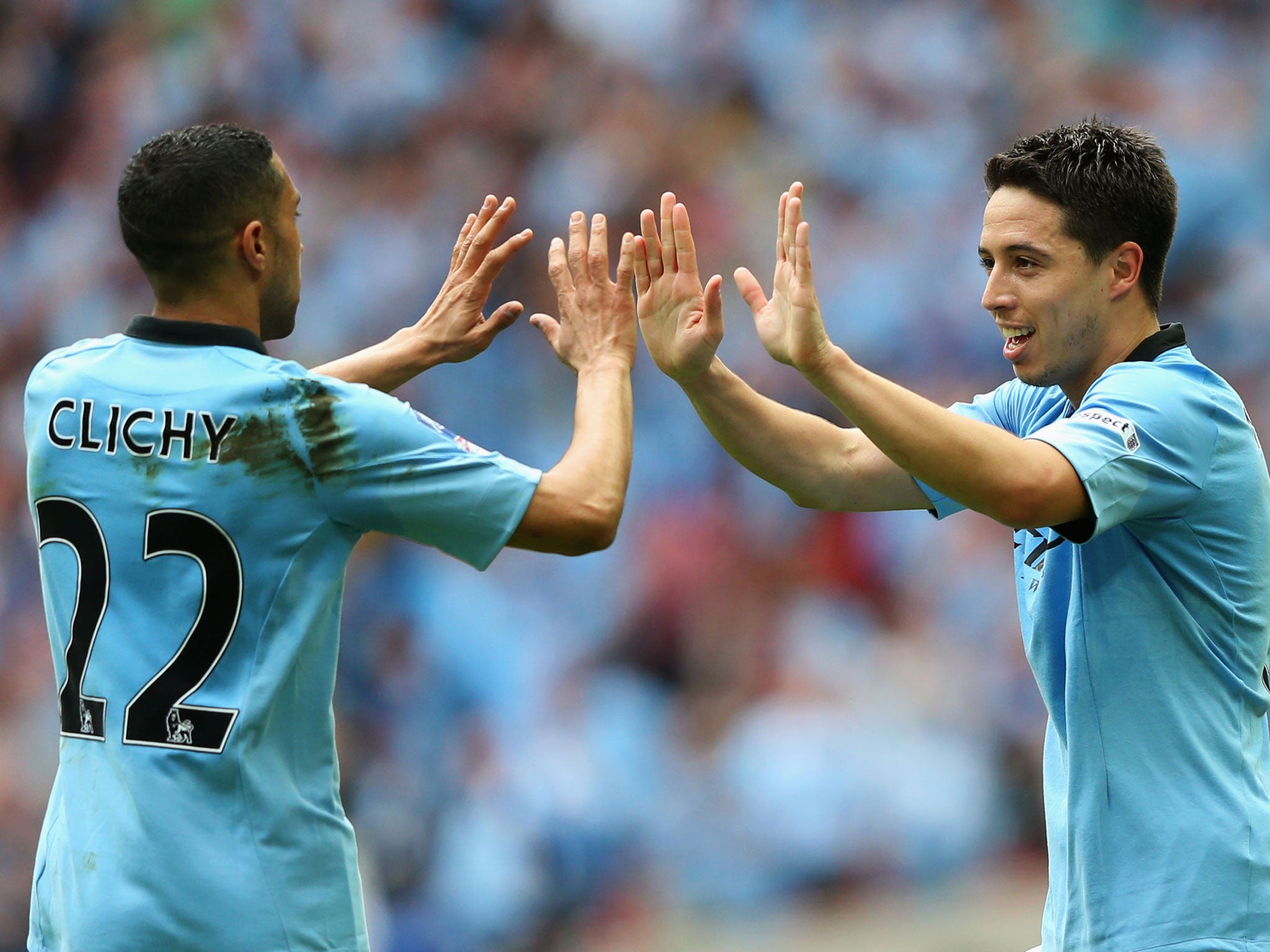 Gael Clichy and Samir Nasri celebrate during City's semi-final win over Chelsea