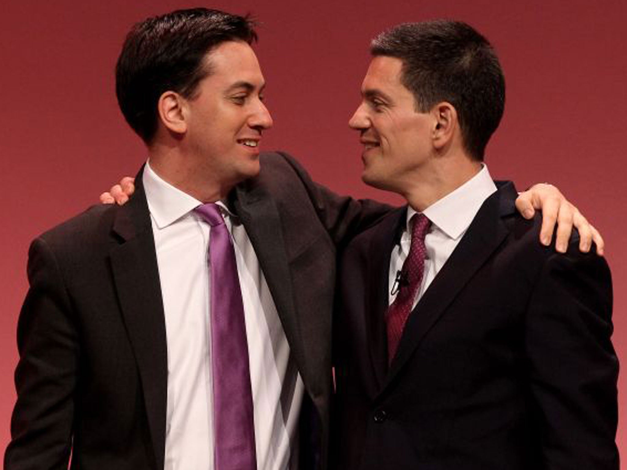 David Miliband, right, is embraced by his brother party leader Ed Miliband