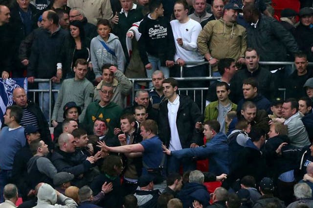 Trouble breaks out between Millwall supporters during the FA Cup with Budweiser Semi Final match between Millwall and Wigan Athletic at Wembley