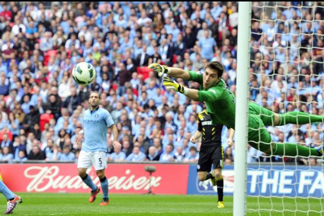 Manchester City’s Costel Pantilimon watches a shot sail wide at Wembley