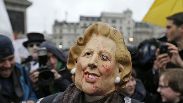 A protester during a party in Trafalgar Square at the weekend celebrating Lady Thatcher’s death. A full military rehearsal for the funeral took place in the early hours of this morning in preparation for Wednesday