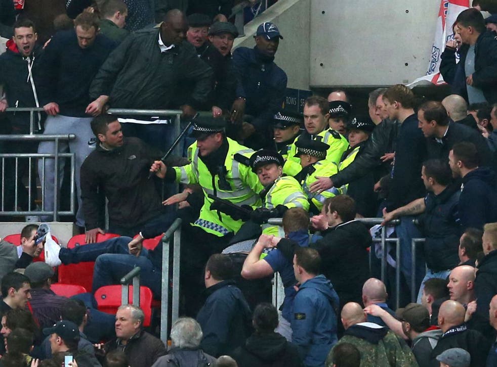 Millwall supporters clash with police at Wembley on Saturday