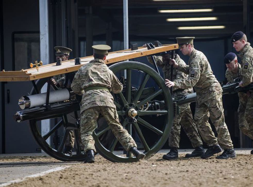 Soldiers prepare the ceremonial cannons before Margaret Thatcher's funeral