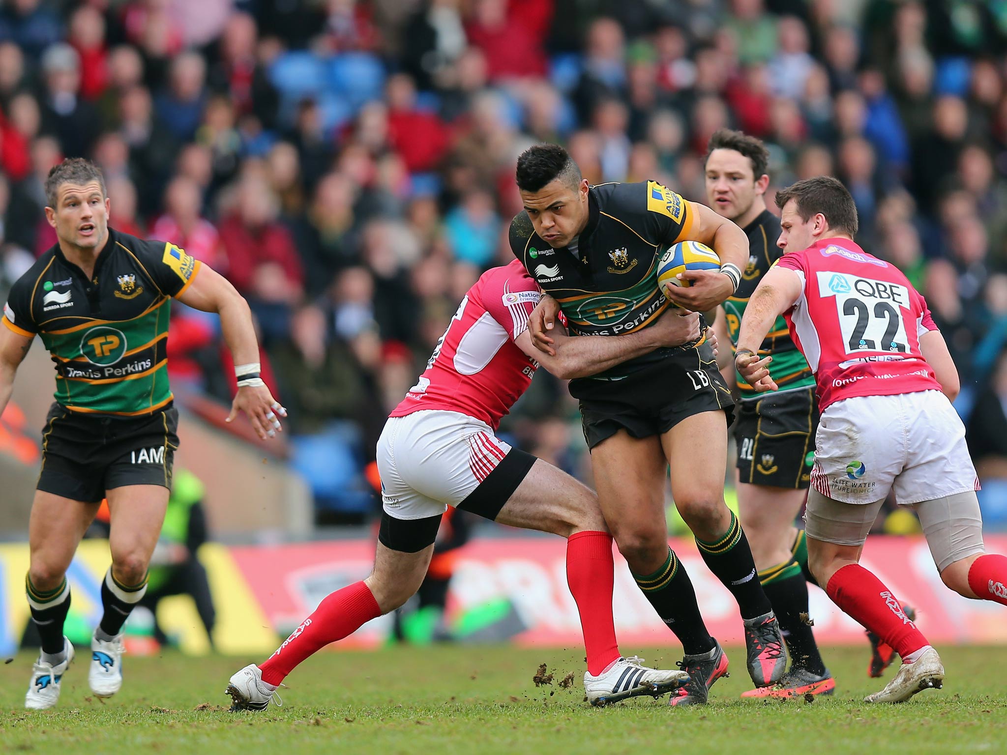 Luther Burrell of Northampton is tackled by Tom Voyce of London Welsh