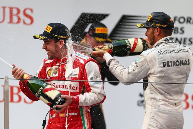 Fernando Alonso celebrates victory at the Chinese Grand Prix
