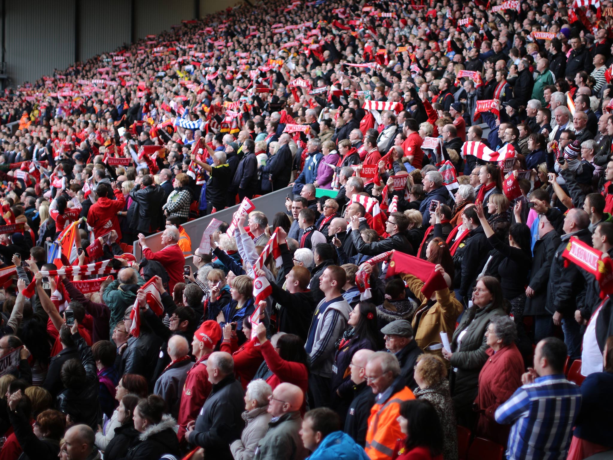 People take part in the Hillsborough memorial service at Anfield