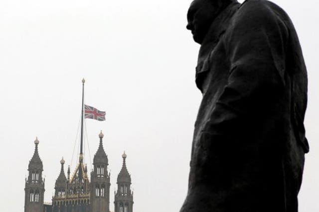 The statue of Winston Churchill in front of the Houses of Parliament as the Union flag flew at half mast after Baroness Thatcher's death. The bells of Big Ben and the Great Clock at Westminster will be silenced during her funeral for the first time since 