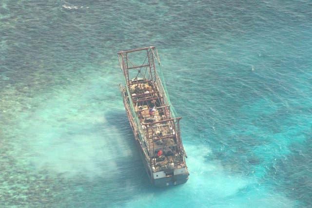 The Chinese boat, Min Long Yu, at the Tubbataha Reef area off the coast of Palawan province, Western Philippines. 12 crew members ran it aground on 08 April at a northern islet of the Tubbataha Marine National Park off Palawan province.