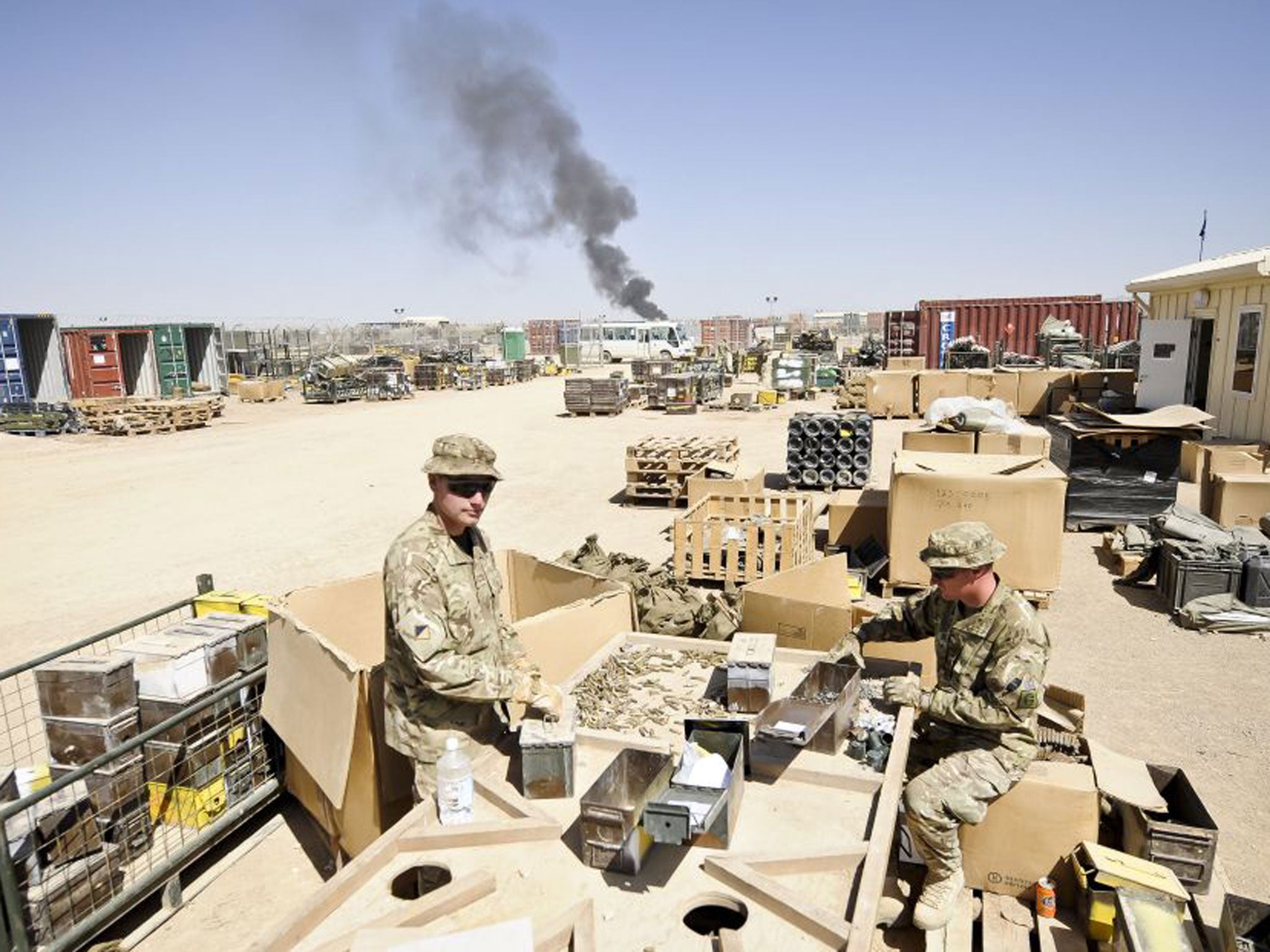 Spent brass ammunition cartridges and links from ammunition belts are sorted and certified free from explosives before being redeployed back to the UK from Camp Bastion