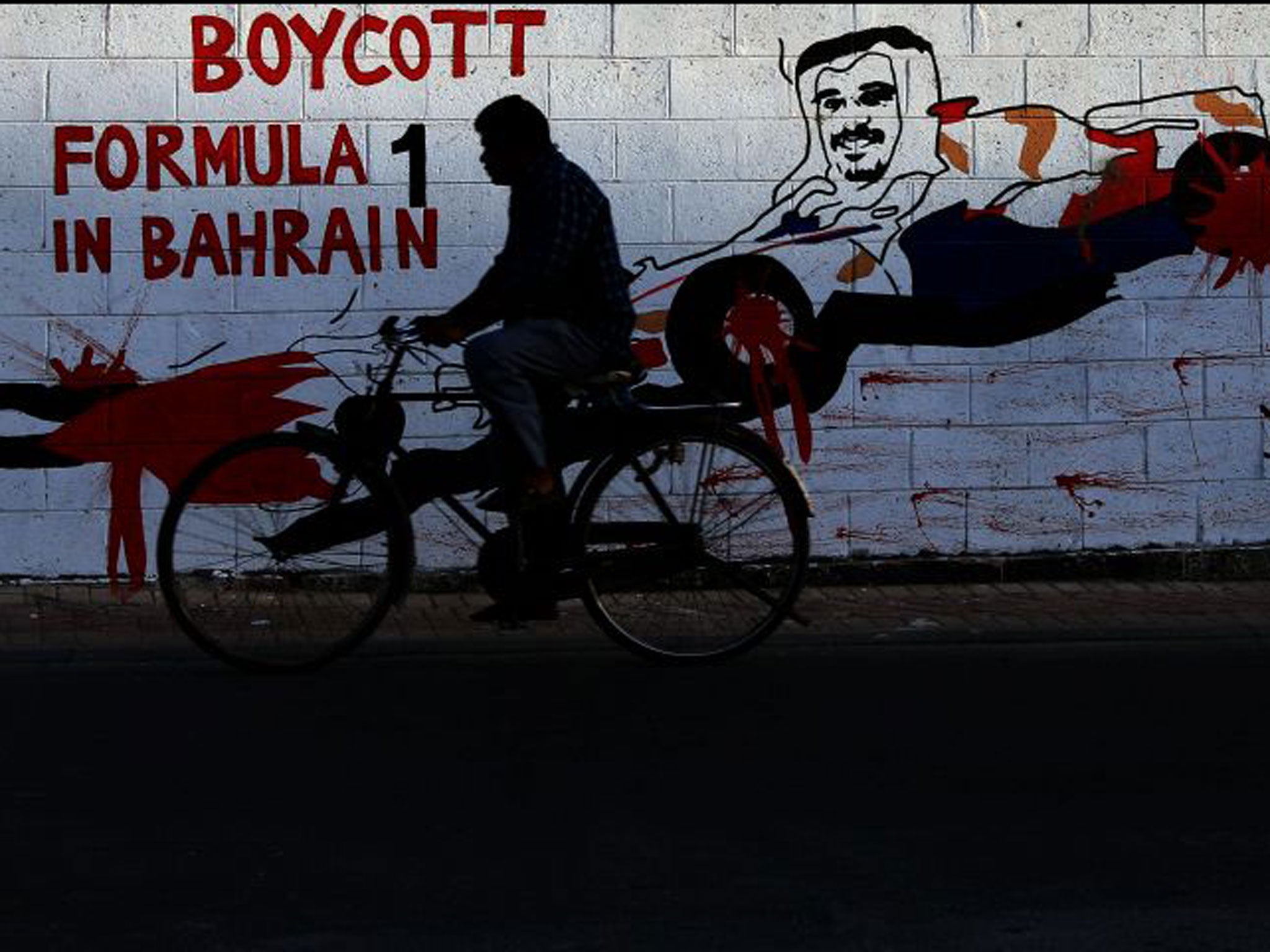 Graffiti in Bharain shows Crown Prince Salman Al Khalifa in a racing car with blood on its wheels