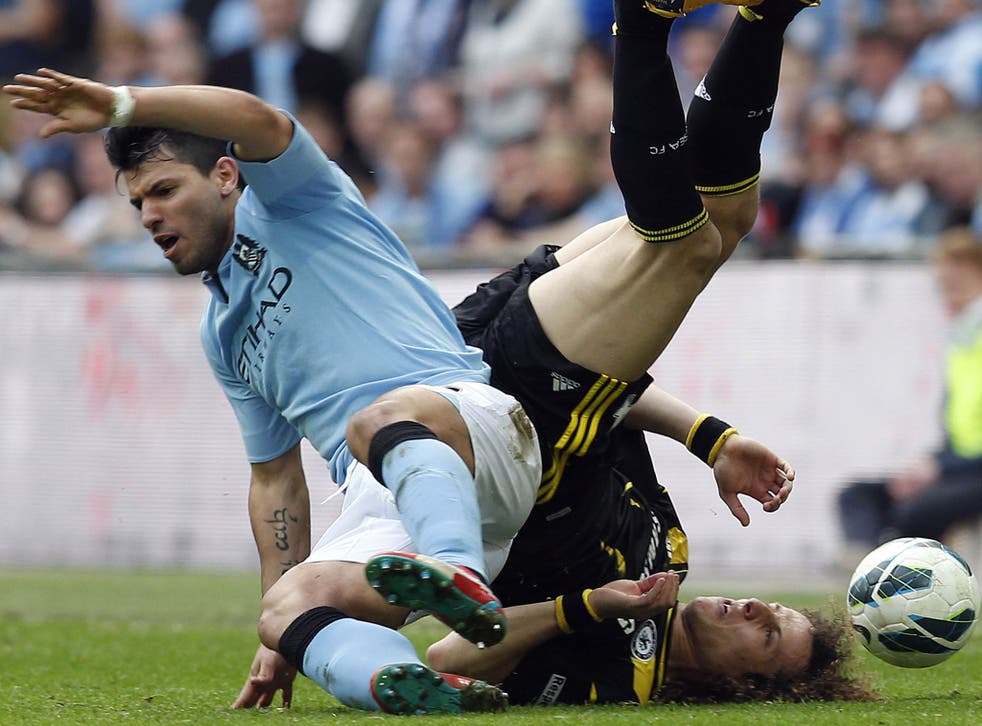 Manchester City’s Sergio Aguero clashes with Chelsea’s David Luiz during the FA Cup semi-final at Wembley