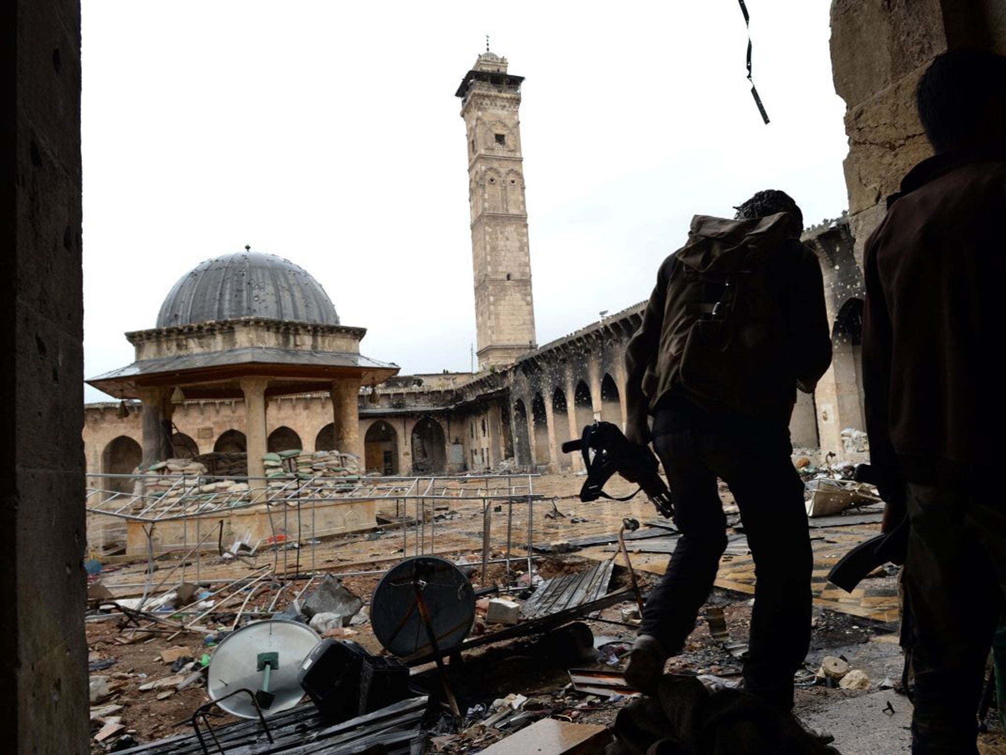 Syrian rebel fighters in the Umayyad Mosque complex in the old city of Aleppo