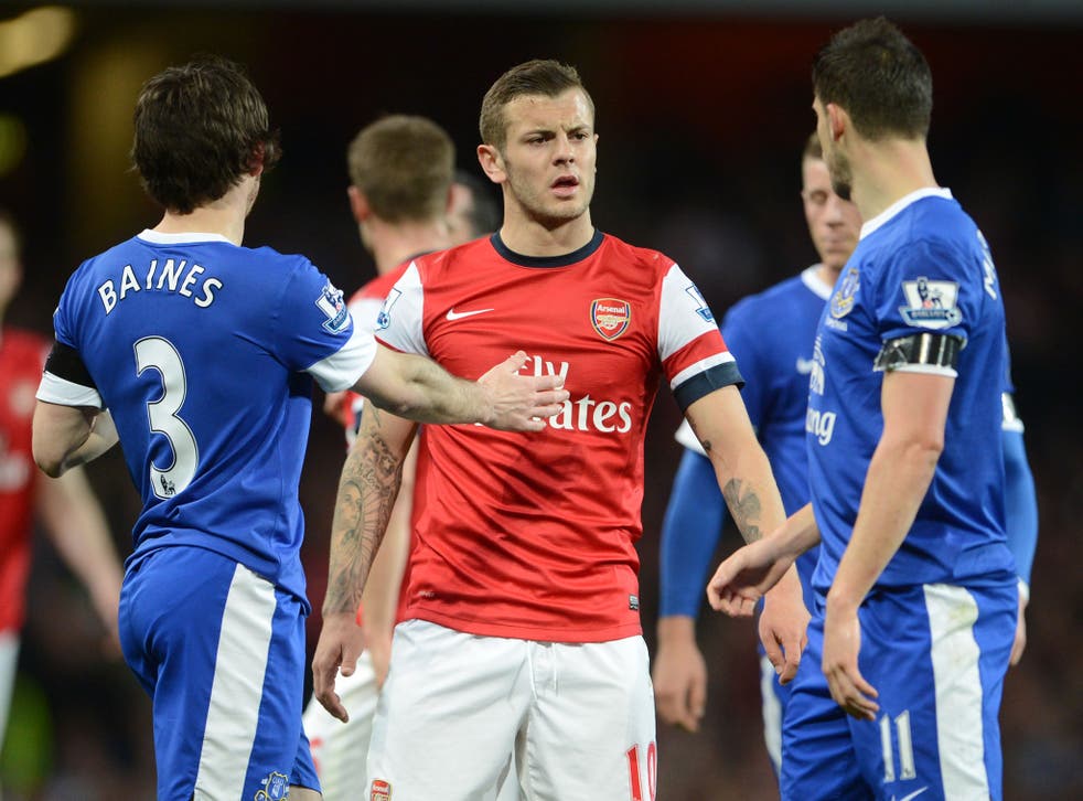 Jack Wilshere (centre) clashes with Everton players including Kevin Mirallas (right) during the 0-0 draw at the Emirates Stadium
