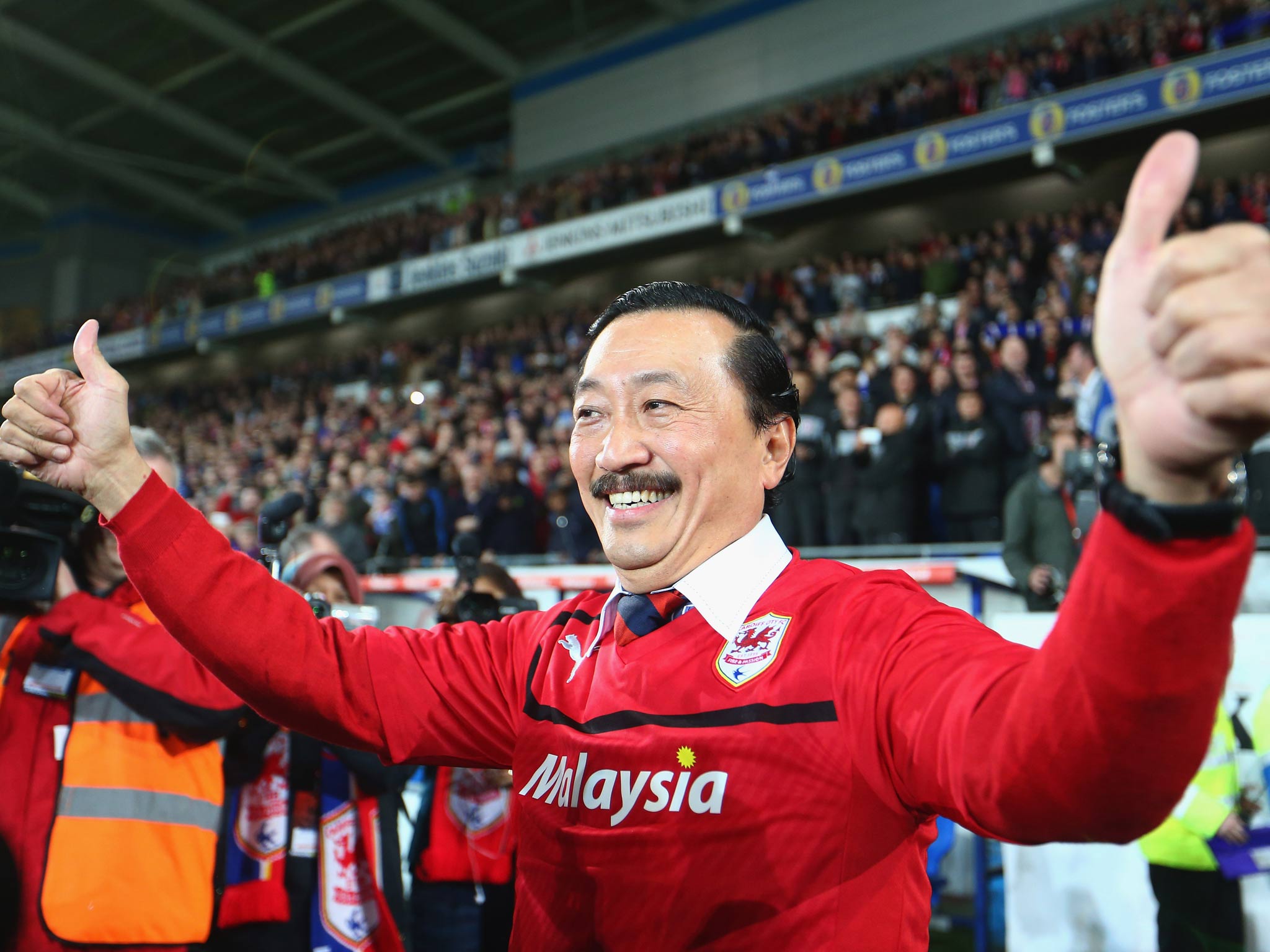 Cardiff City owner Vincent Tan celebrates his team's promotion