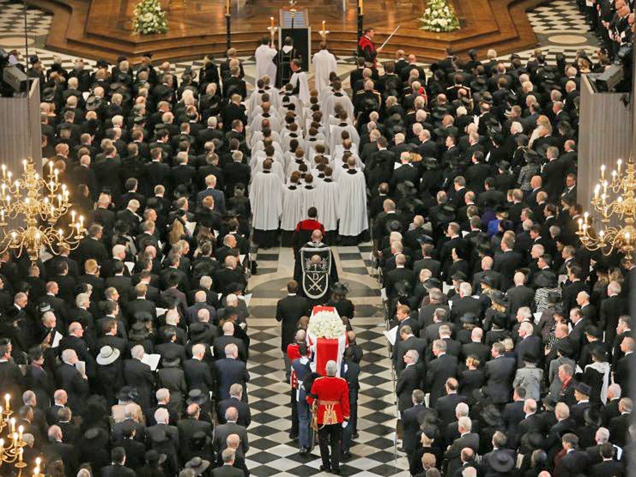 The coffin of former British prime minister Margaret Thatcher is carried by the Bearer Party as it arrives for her funeral service at St Paul's Cathedral