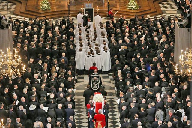 The coffin of former British prime minister Margaret Thatcher is carried by the Bearer Party as it arrives for her funeral service at St Paul's Cathedral