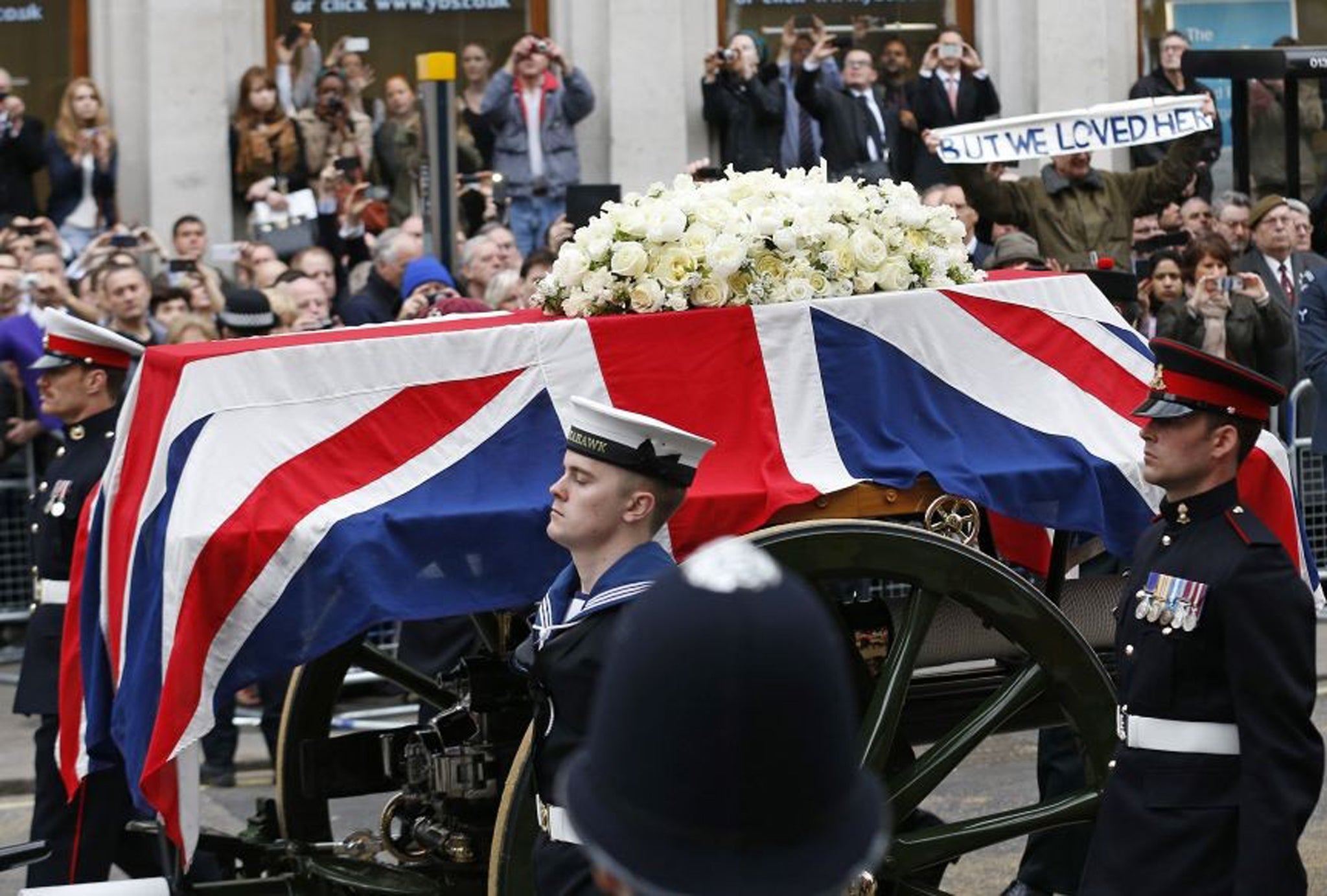 A Union flag draped coffin bearing the body of former Prime Minister Margaret Thatcher is carried on a gun carriage drawn by the King's Troop Royal Artillery