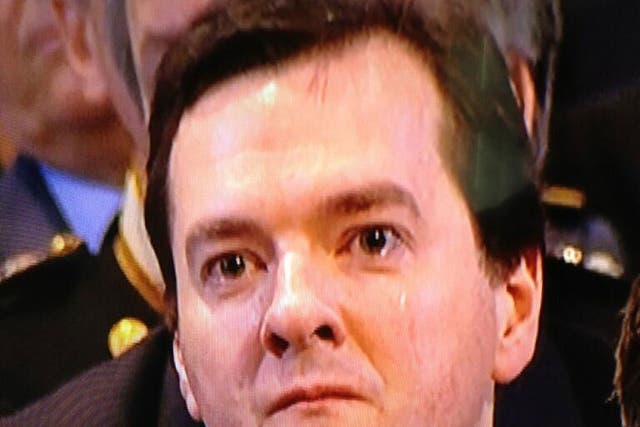 George Osborne appears to be crying and is seen wiping away a tear during the service