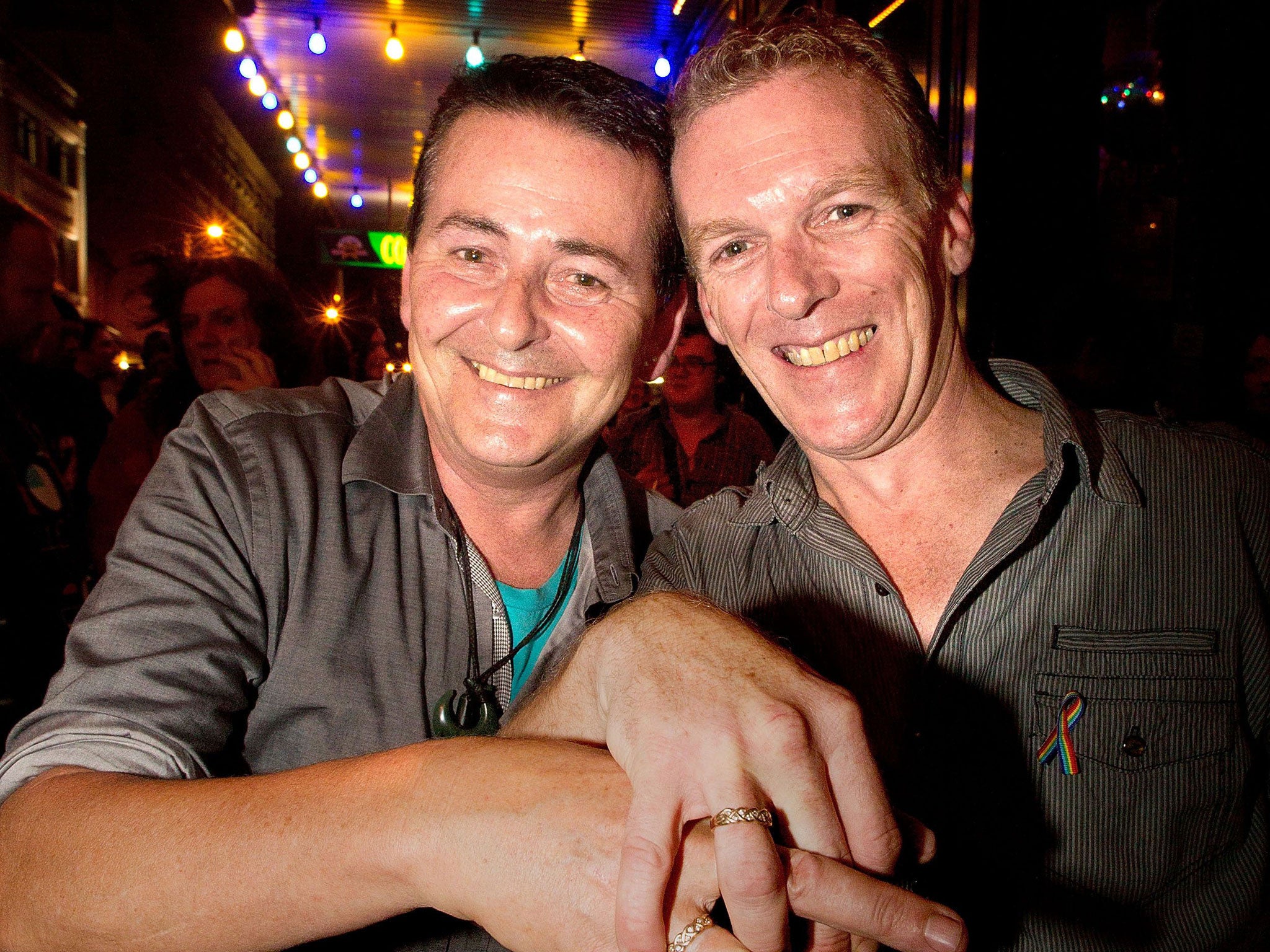 Scotty and Mal from S&M's (Scotty and Mal's Cocktail and Lounge Bar) in Wellington show off their wedding rings after New Zealand became the first Asia-Pacific country to legalise same-sex marriage