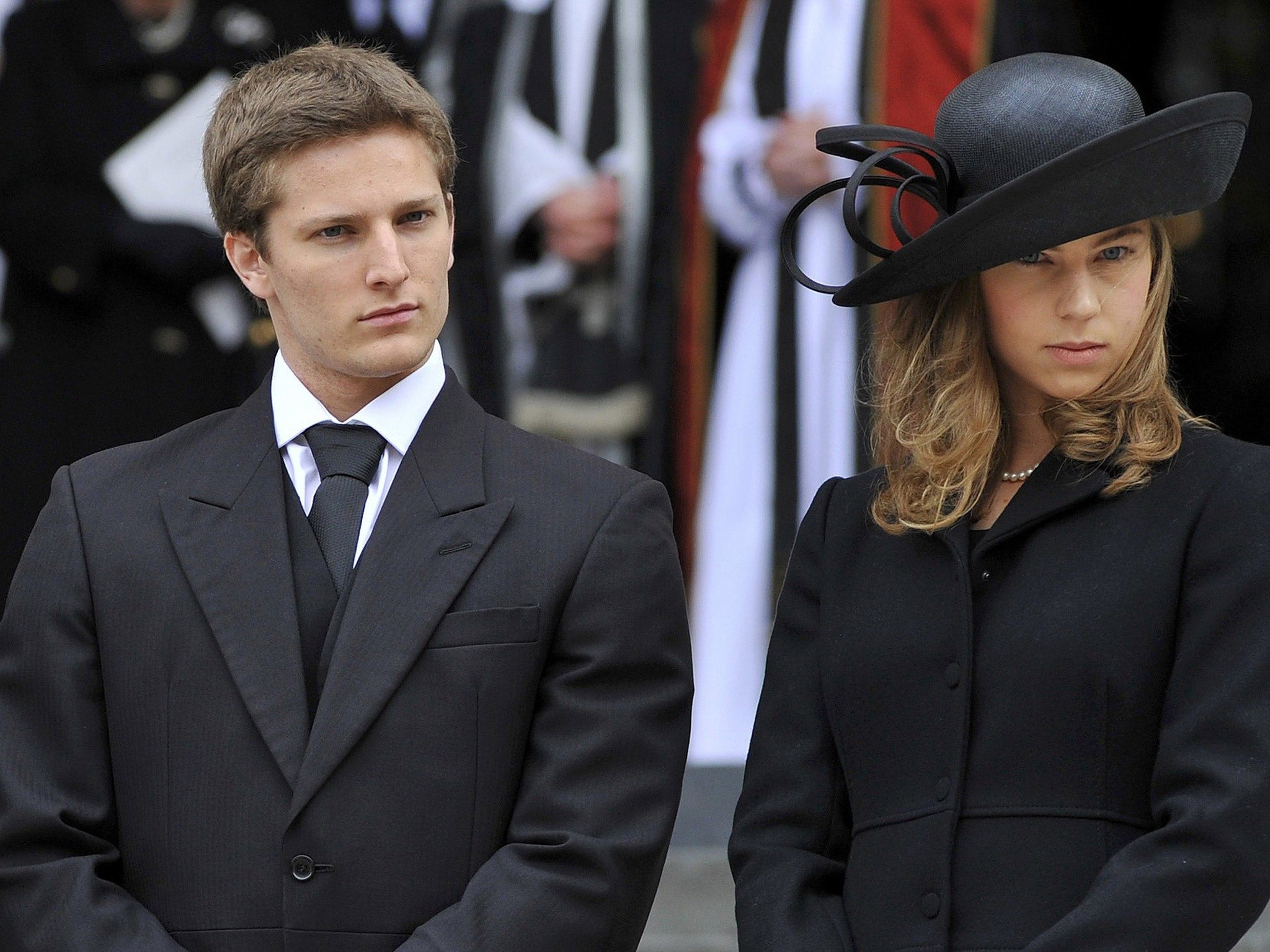 Michael and Amanda Thatcher, grand children of former British prime minister Margaret Thatcher, react as they leave her funeral service at St Paul's Cathedral