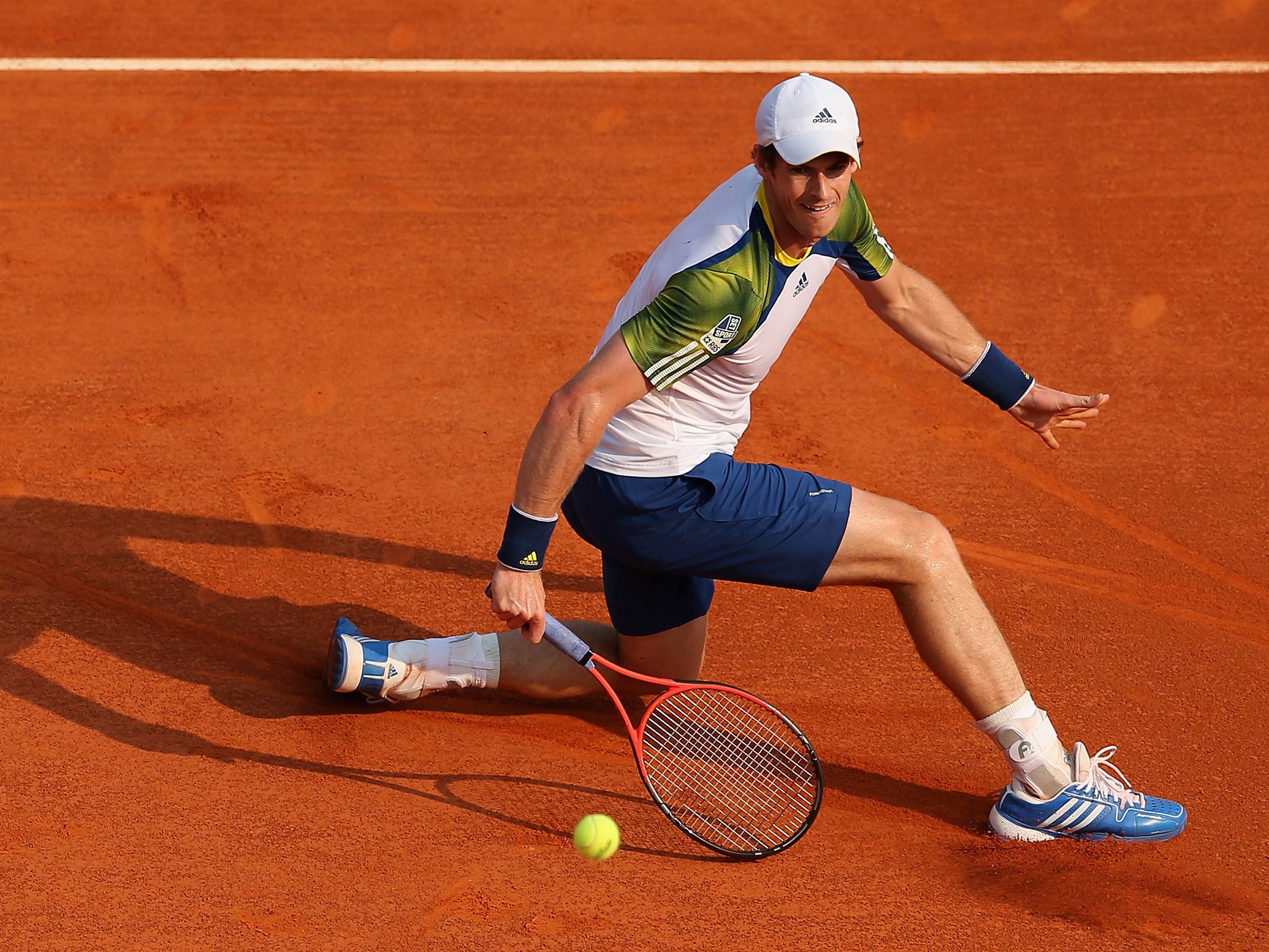 Andy Murray of Great Britain plays a backhand volley against Edouard Roger-Vasselin of France in their second round match during day four of the ATP Monte Carlo Masters