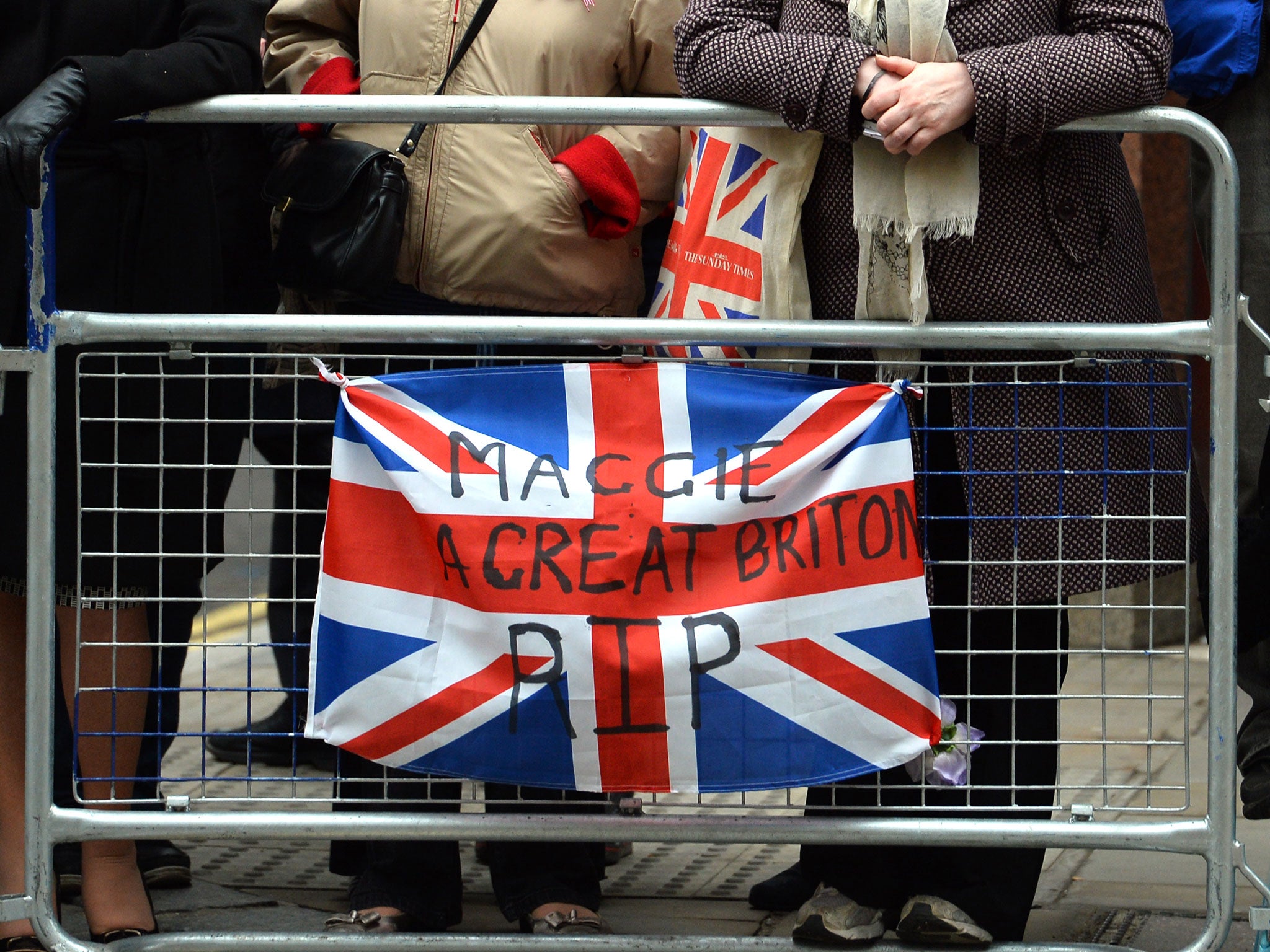 People line-up the streets as they wait to pay their last respects to former British prime minister Margaret Thatcher during her ceremonial funeral in London April 17, 2013. The turn-out was much lower than expected
