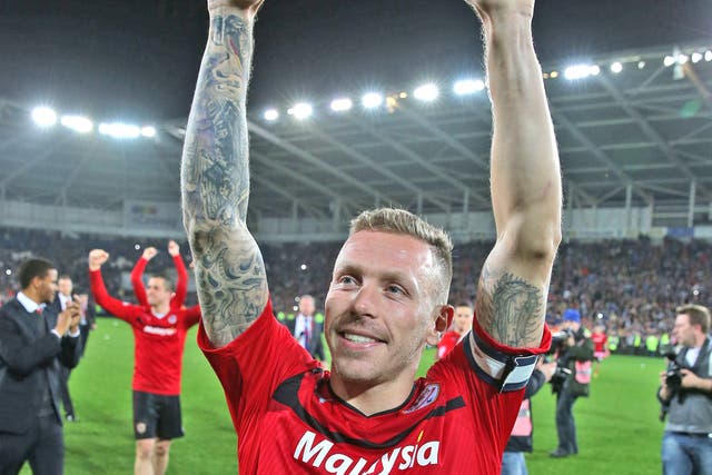 Craig Bellamy celebrates Cardiff being promoted to the Premier League