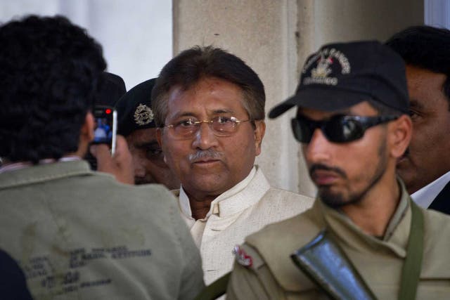 Pakistan's former president and military ruler Pervez Musharraf, centre, leaves court