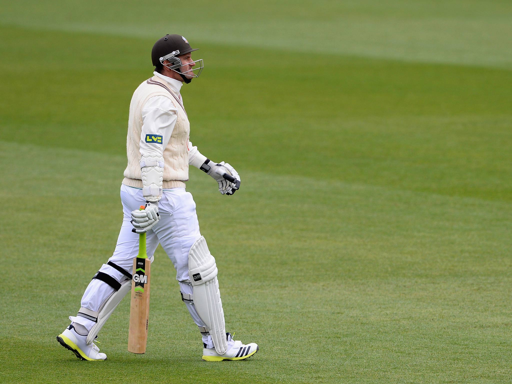 Graeme Smith of Surrey makes his way back to the pavilion having been dismissed for two