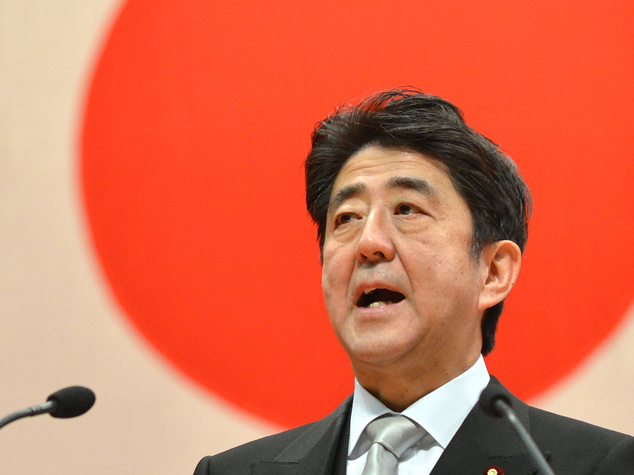 Japanese Prime Minister Shinzo Abe delivers a speech during a graduation ceremony at the National Defense Academy in Yokosuka, Kanagawa Prefecture on March 17, 2013.
