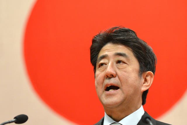 Japanese Prime Minister Shinzo Abe delivers a speech during a graduation ceremony at the National Defense Academy in Yokosuka, Kanagawa Prefecture on March 17, 2013.